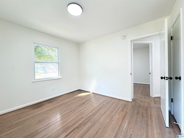 unfurnished room featuring light hardwood / wood-style floors