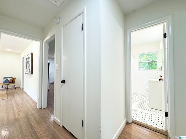 corridor featuring light wood-type flooring