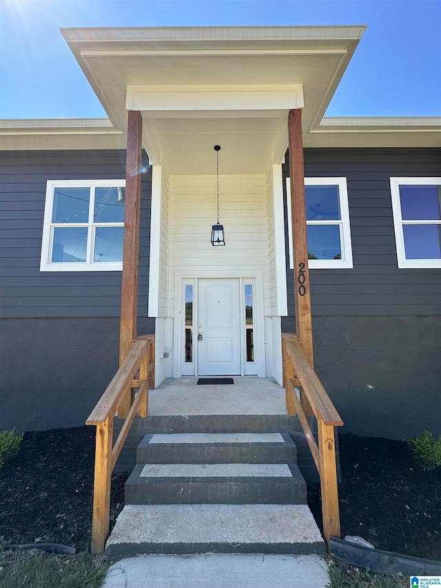 property entrance featuring covered porch