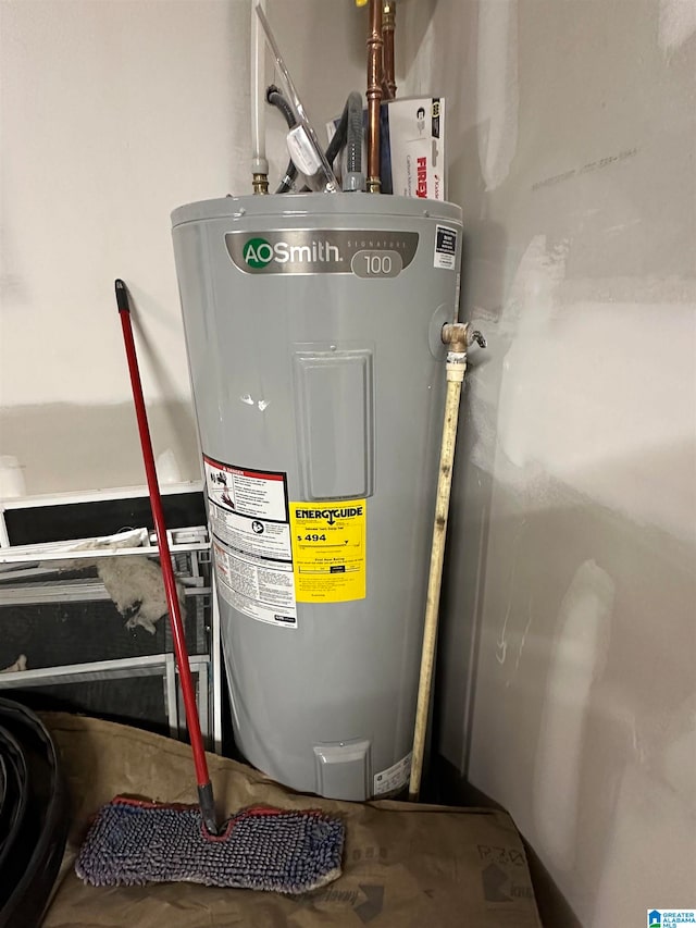 utility room featuring electric water heater