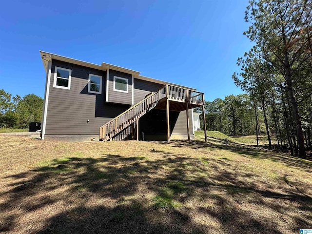 back of property featuring a wooden deck