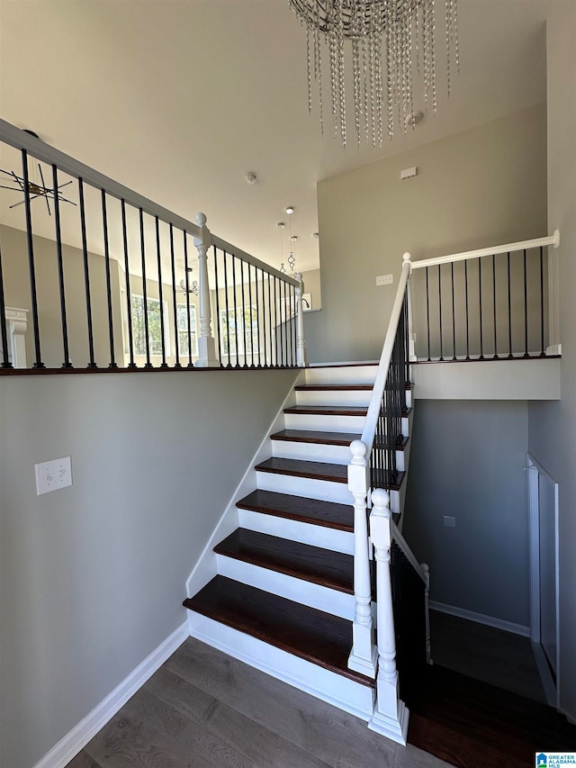 stairway with hardwood / wood-style floors