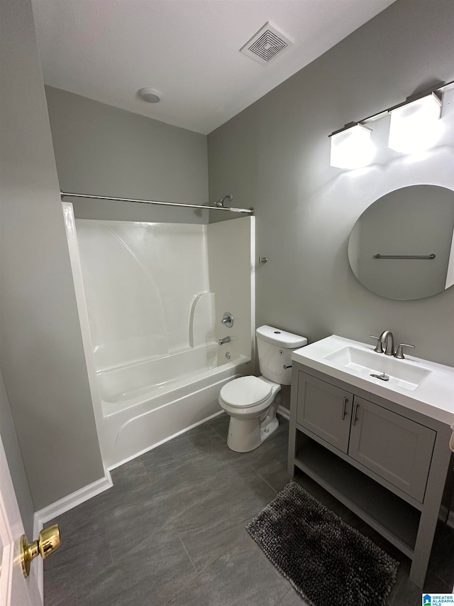 full bathroom featuring tub / shower combination, vanity, and toilet