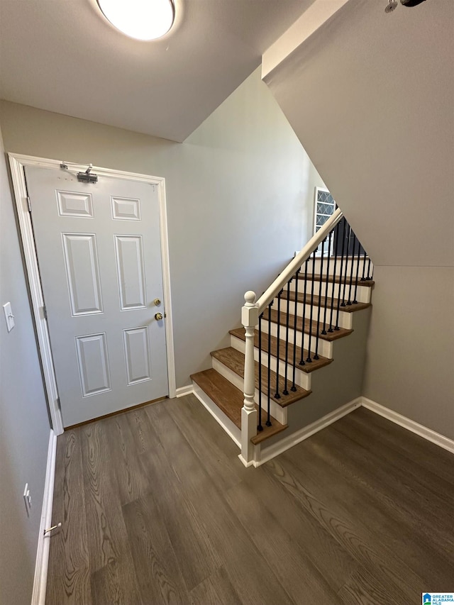 staircase featuring hardwood / wood-style floors