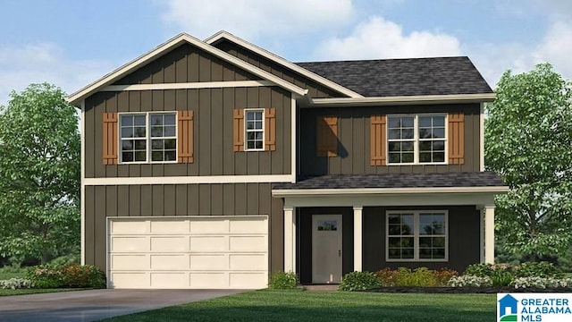 view of front of property with a garage and a front yard