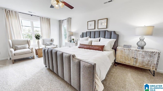 bedroom with light carpet and ceiling fan