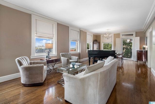 living room with a notable chandelier, plenty of natural light, dark hardwood / wood-style floors, and crown molding