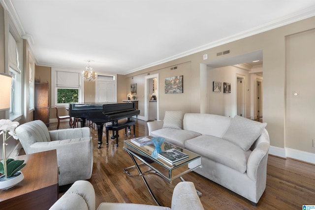 living room with a chandelier, dark wood-type flooring, and crown molding