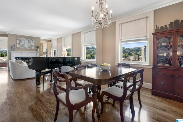 dining space featuring crown molding, dark hardwood / wood-style flooring, and a wealth of natural light