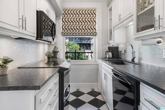 kitchen with stainless steel electric range, dishwasher, sink, and white cabinetry