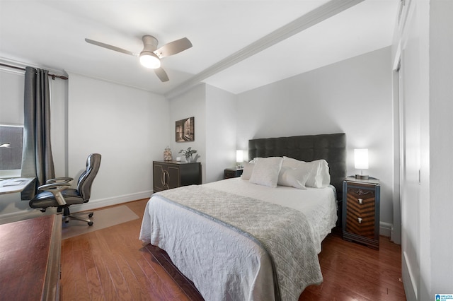 bedroom with crown molding, dark hardwood / wood-style floors, and ceiling fan