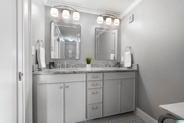 bathroom with ornamental molding, tile patterned flooring, and vanity