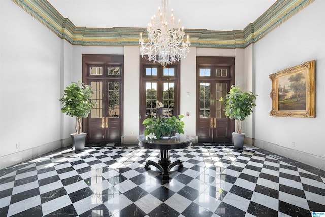 interior space featuring a notable chandelier, a high ceiling, french doors, and crown molding