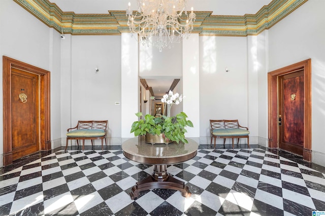 entrance foyer featuring an inviting chandelier and a high ceiling