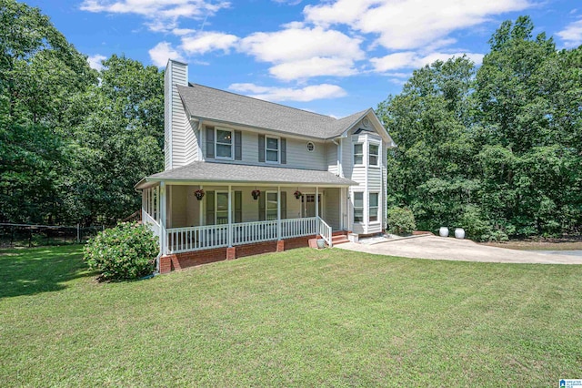 view of front of house with a front yard and a porch