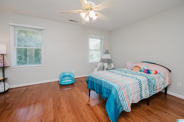 bedroom featuring hardwood / wood-style floors and ceiling fan