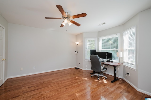 office space with ceiling fan and hardwood / wood-style flooring