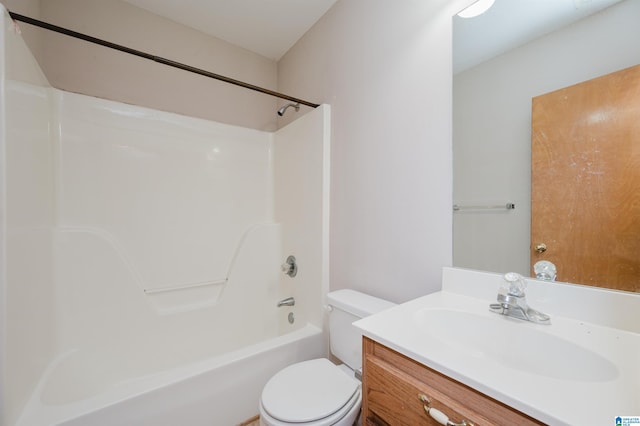 full bathroom featuring tub / shower combination, vanity, and toilet