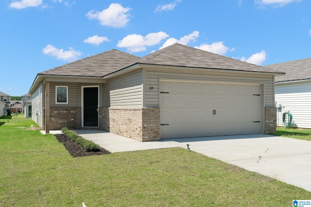ranch-style home featuring a garage, concrete driveway, a front yard, brick siding, and roof with shingles