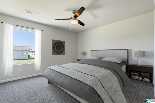 bedroom with carpet flooring, baseboards, ceiling fan, and visible vents