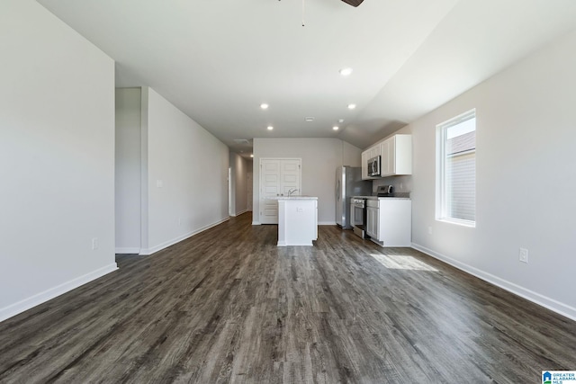 unfurnished living room with baseboards, dark wood-style flooring, recessed lighting, and a ceiling fan