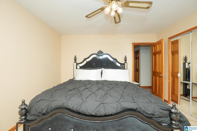 bedroom with ceiling fan, a textured ceiling, a closet, and carpet