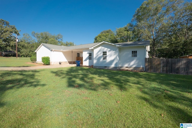 ranch-style home featuring a front yard