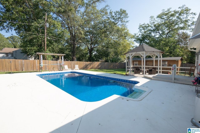 view of pool with a patio and a gazebo