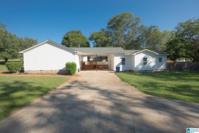 ranch-style home with a front lawn and a carport