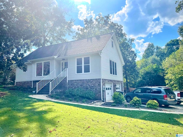 view of front of property featuring a garage and a front lawn