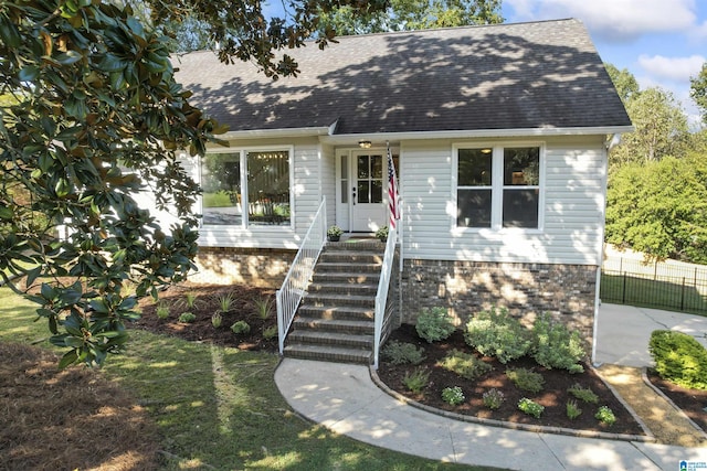 2825 Cahawba Trl, Birmingham, AL 35243 - cape cod house featuring a front yard, fence, and roof with shingles