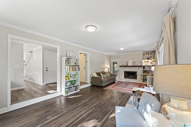 2825 Cahawba Trl, Birmingham, AL 35243 - living area with a brick fireplace, baseboards, crown molding, and wood finished floors