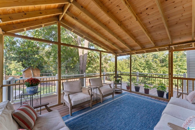 sunroom / solarium with lofted ceiling with beams and wooden ceiling