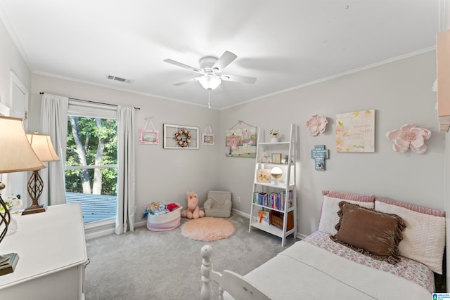 bedroom with crown molding, carpet, and ceiling fan