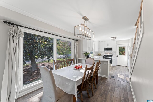 2825 Cahawba Trl, Birmingham, AL 35243 - dining area with dark wood-type flooring, a notable chandelier, and baseboards