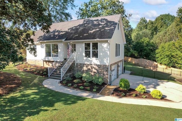 view of front facade with a front yard and a garage