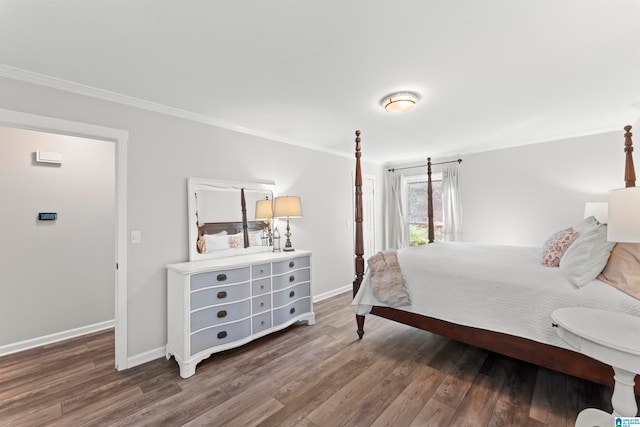 bedroom with ornamental molding and dark hardwood / wood-style floors