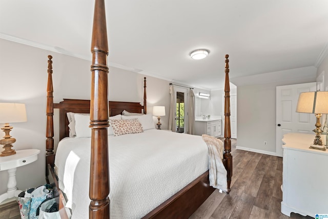 bedroom featuring crown molding, dark hardwood / wood-style floors, and ensuite bath