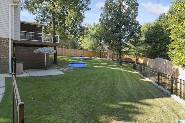 2825 Cahawba Trl, Birmingham, AL 35243 - view of yard with a fenced backyard, a playground, a patio, and a sunroom