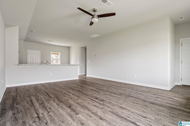 unfurnished living room with ceiling fan and hardwood / wood-style flooring