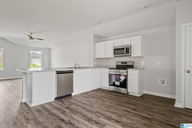 kitchen featuring ceiling fan, white cabinets, appliances with stainless steel finishes, and kitchen peninsula