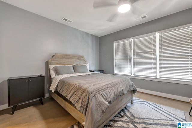 bedroom featuring hardwood / wood-style floors and ceiling fan