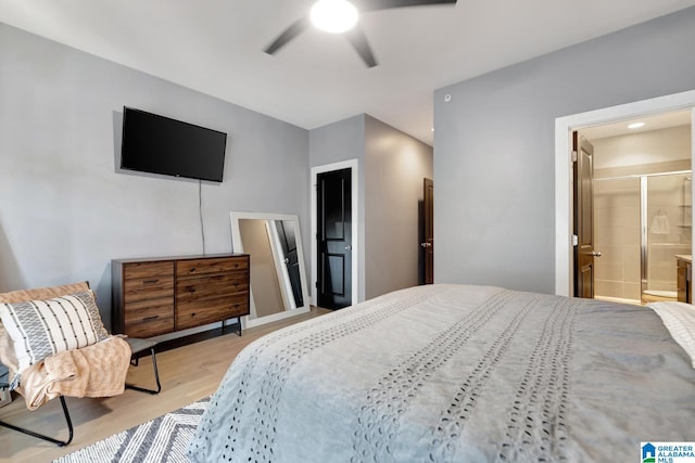 bedroom with light hardwood / wood-style flooring, connected bathroom, and ceiling fan