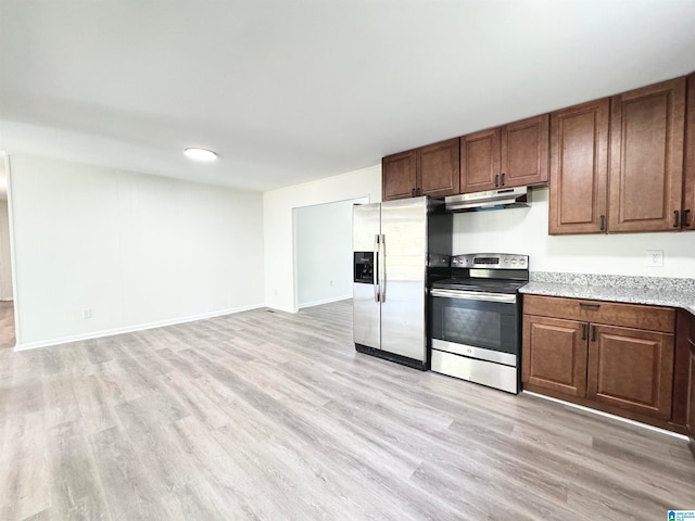 kitchen with appliances with stainless steel finishes and light wood-type flooring