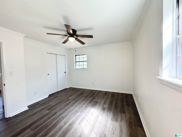 unfurnished room featuring ornamental molding, dark hardwood / wood-style flooring, and ceiling fan