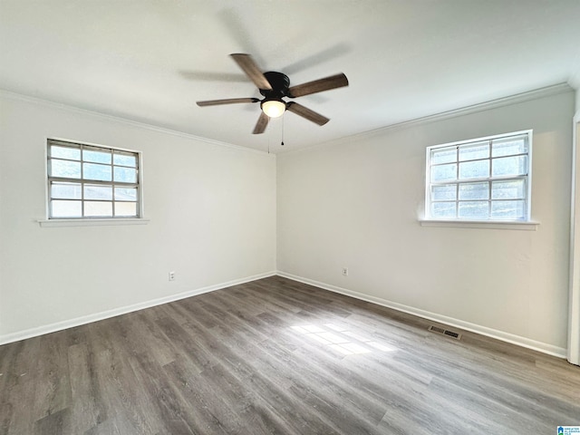 unfurnished room with ornamental molding, hardwood / wood-style floors, ceiling fan, and a healthy amount of sunlight