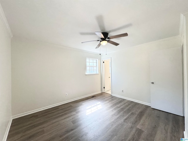 unfurnished room featuring ceiling fan, ornamental molding, and dark wood-type flooring