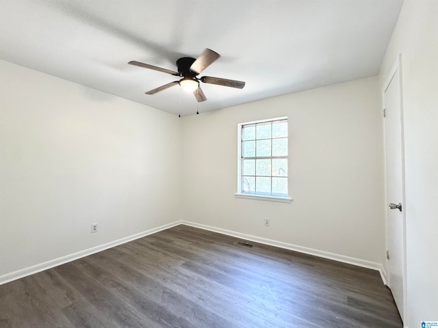 unfurnished room with ceiling fan and dark hardwood / wood-style floors