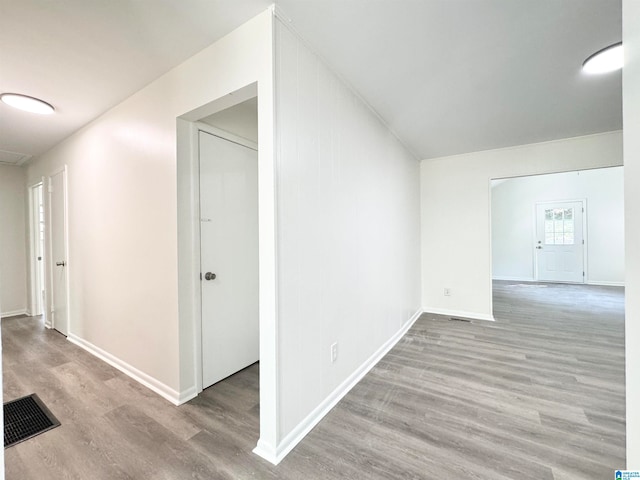 hall with light hardwood / wood-style floors