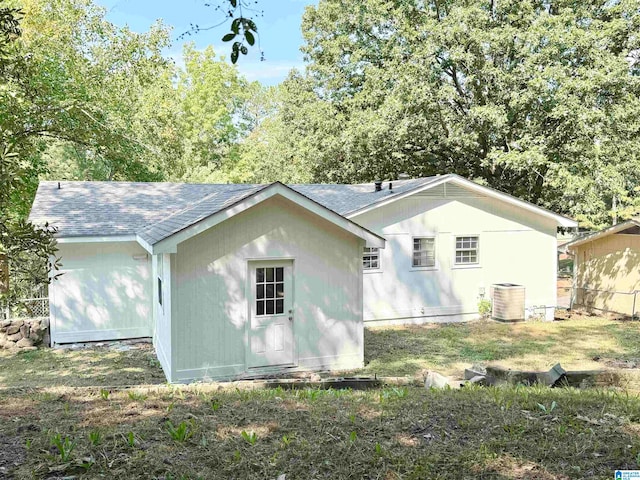 rear view of house with central air condition unit